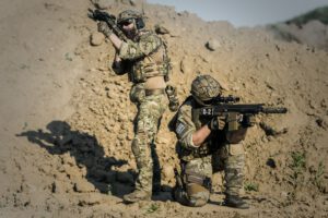 soldiers in desert terrain