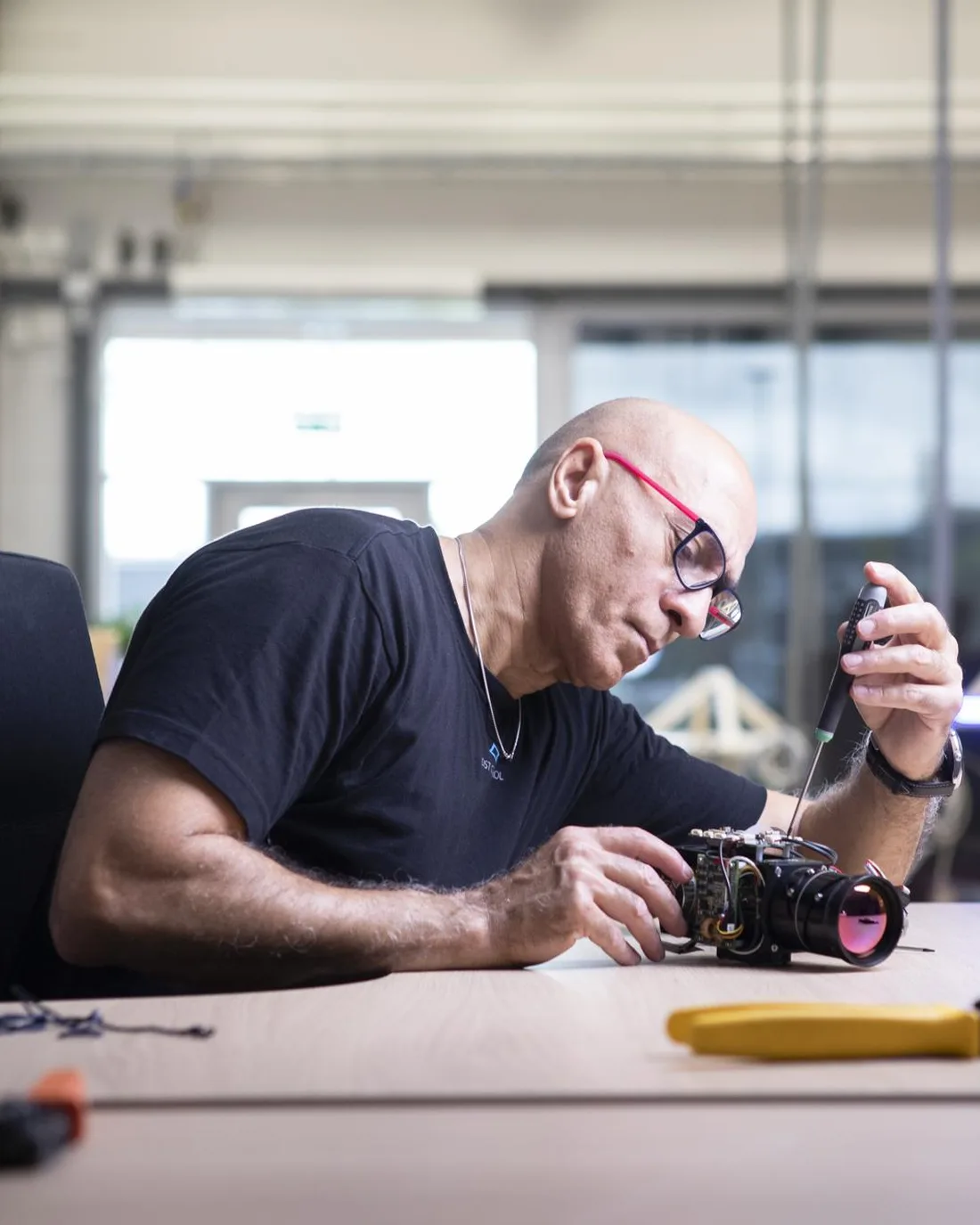 DST Control engineer assembling an EO/IR camera module in the Linköping workshop