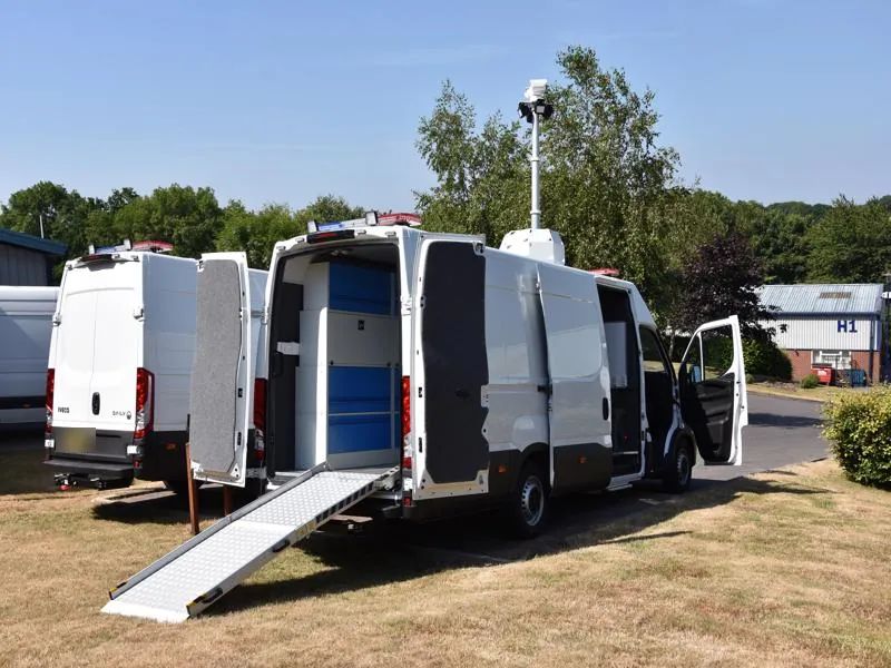 Mobile surveillance van with integrated equipment racks