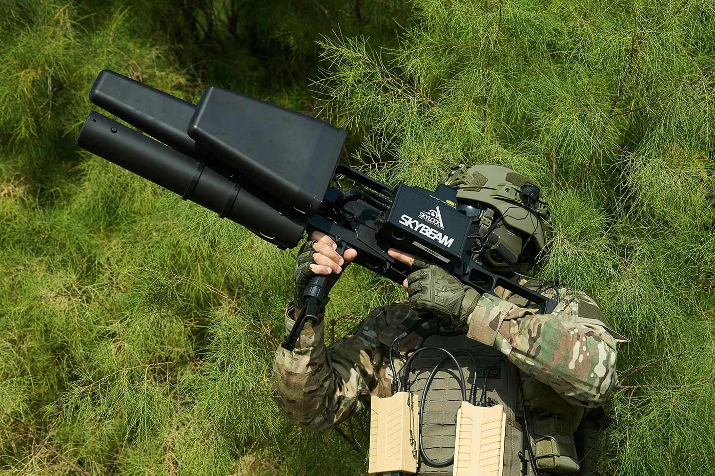 Soldier aiming a Skylock SkyBeam handheld counter-drone system