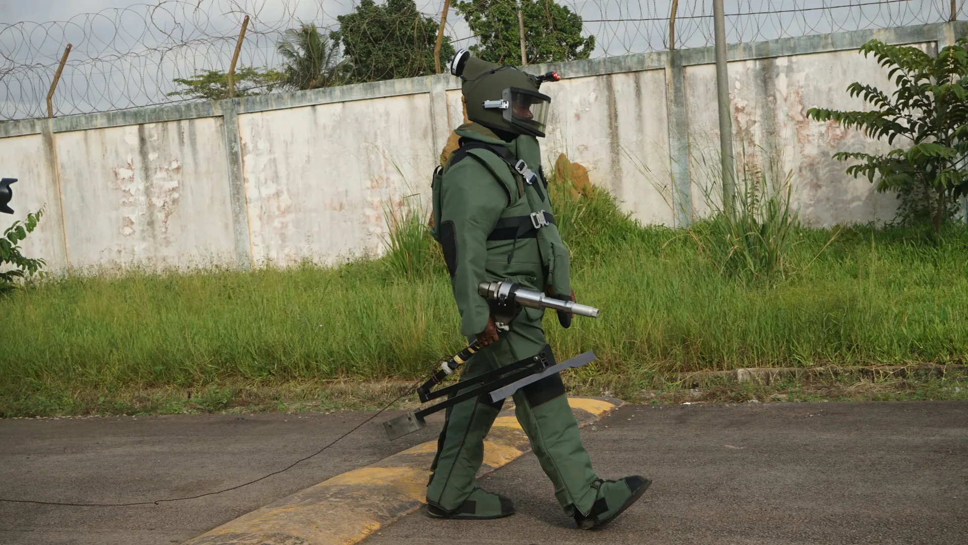 EOD operator in a bomb-disposal suit during in-country delivery